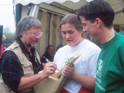 Bill Oddie signing an autograph on a bird box. Thatcham 1995